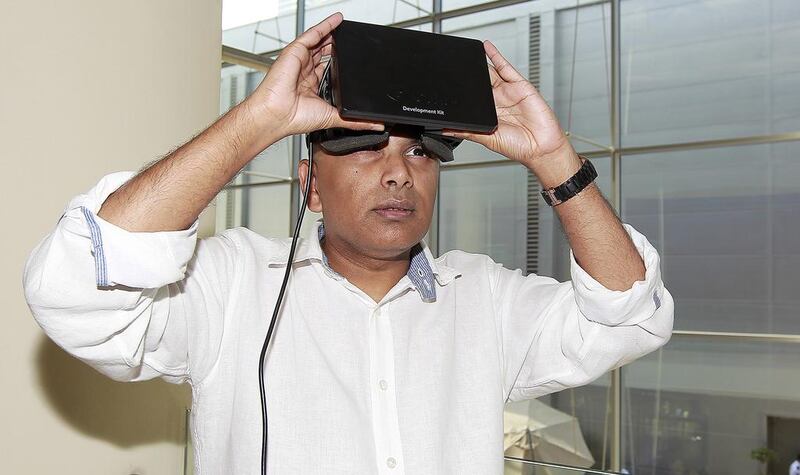Clyde DeSouza with thew virtual reality headset he believes will make learning more interactive. Jeffrey E Biteng / The National