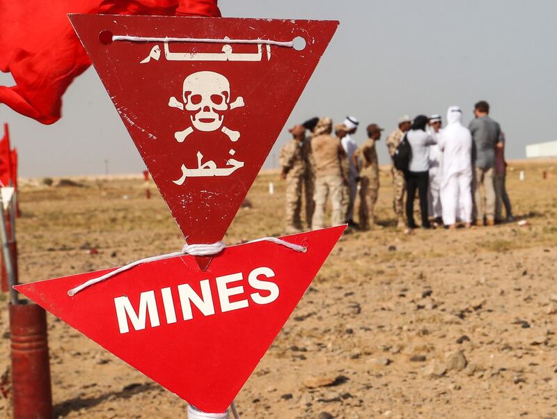 Yemeni forces sweep for mines. AFP