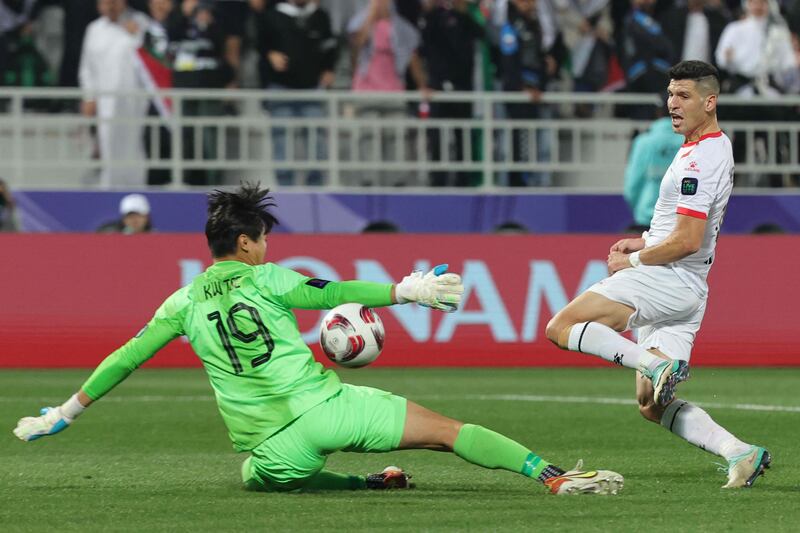 Hong Kong's goalkeeper Tse Ka Wing makes a vital save from Tamer Seyam. AFP 