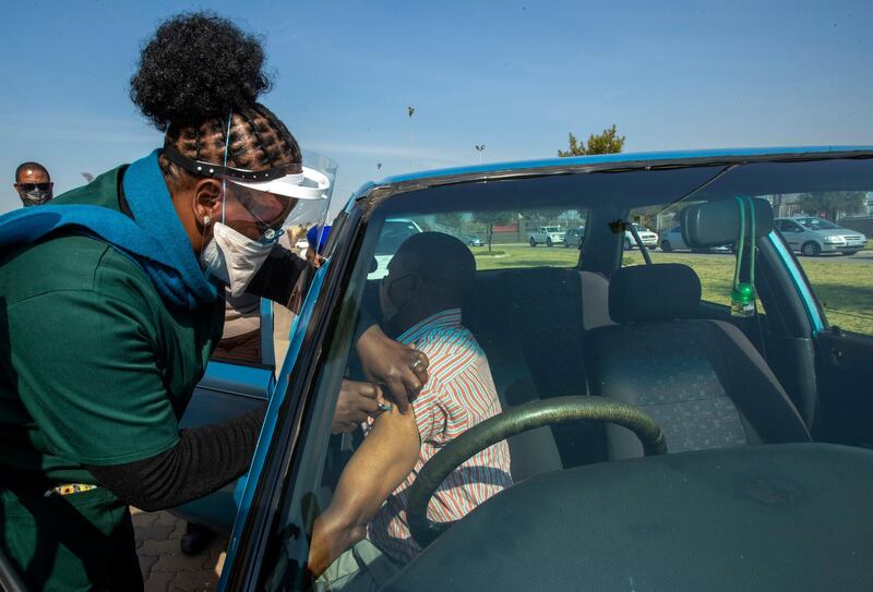A health worker vaccinates a pensioner with a first dose of the Pfizer Covid-19 shot in Johannesburg, South Africa. AP