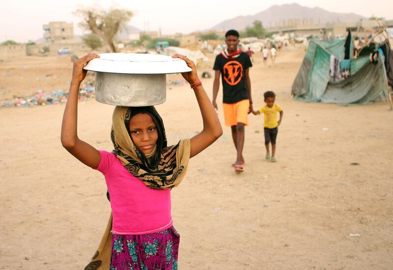 Displaced Yemenis who fled fighting between Yemen's armed rebels, known as the Huthis, and pro-government forces in Hodeida, are pictured at a makeshift camp in the district of Abs, in Yemen's northwestern Hajjah province.  AFP