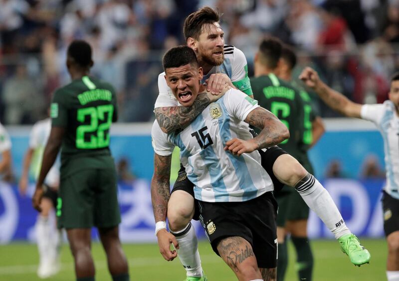 Soccer Football - World Cup - Group D - Nigeria vs Argentina - Saint Petersburg Stadium, Saint Petersburg, Russia - June 26, 2018   Argentina's Marcos Rojo celebrates scoring their second goal with Lionel Messi    REUTERS/Henry Romero