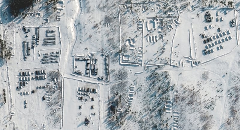 This satellite image shows troops gathered at a training ground in Pogonovo, Russia. AP Photo