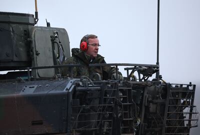 German Defence Minister Boris Pistorius in a tank on a visit to a military training ground on Thursday. AFP 