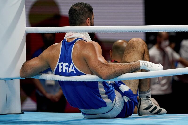 France's Mourad Aliev reacts after losing by disqualification.