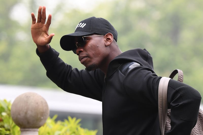 France's national football team's midfielder Paul Pogba arrives at the team's training camp ahead of the 2018 World Cup, on May 23, 2018 at France's training centre in Clairefontaine-en-Yvelines, outside Paris. / AFP / FRANCK FIFE
