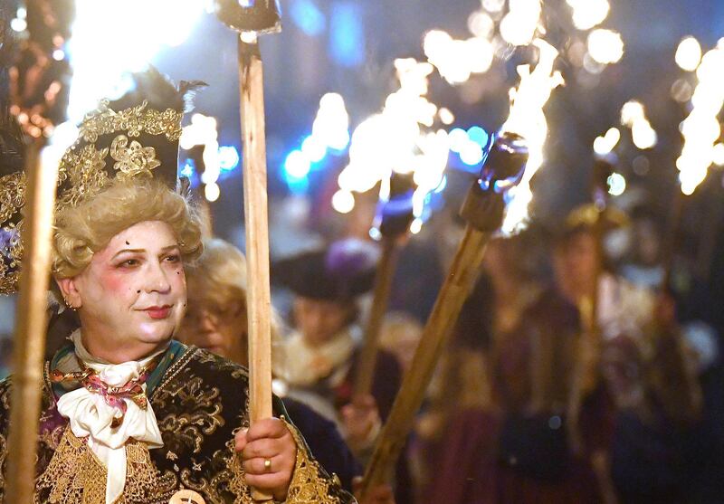 Participants parade through the town. Reuters