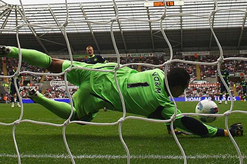 And the Swansea goalkeeper Michael Vorm ensured that fans would go home happy as he kept out a Ben Watson penalty to share the points in a 0-0 draw.

Matthew Lewis / Getty Images