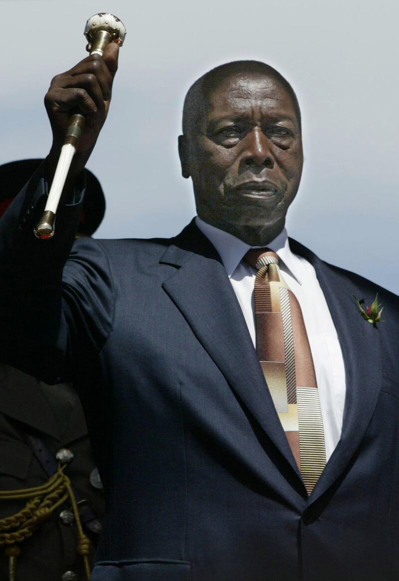 NAIROBI, KENYA - DECEMBER 30:  Outgoing Kenyan President Daniel arap Moi salutes during a swearing-in ceremony for President-elect Mwai Kibaki December 30, 2002 in Nairobi, Kenya. Kibaki, former vice president and finance minister to Moi, representing the opposition National Rainbow Coalition (NARC) vowed to crack down on corruption and poverty. The December 27, 2002 general elections ends Moi's 24-year, autocratic rule.  (Photo by Alessandro Abbonizio/Getty Images)