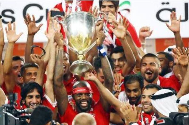 Al Ahli lift the trophy at the Jazira Mohamed bin Zayed Stadium in Abu Dhabi. Satish Kumar / The National