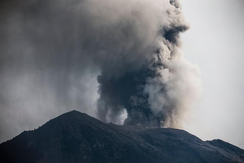 The Mount Agung volcano spews hot volcanic ash, as seen from the Besakih Temple in Karangasem, Bali, Indonesia, on November 28, 2017. Made Nagi / EPA