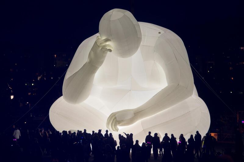 Sculpture 'Man' by Australian artist Amanda Paren on display during the City of Light weekend in Jyvaskyla, Finland.  EPA