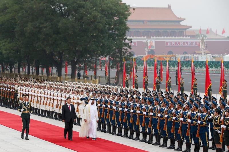 Sheikh Mohamed bin Zayed and President Xi Jinping review an honour guard during a welcome ceremony at the Great Hall of the People in Beijing on Monday. Andy Wong / AP