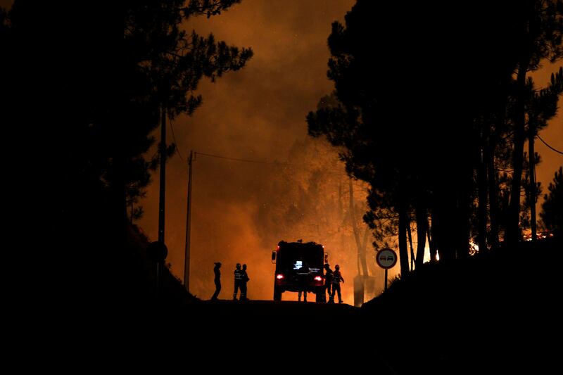 Portuguese firefighters tackle a forest fire at Paredes, Vila de Rei.  Paulo Cunha / EPA