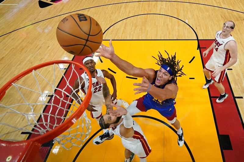 Denver Nuggets forward Aaron Gordon shoots, under pressure from Miami Heat's Caleb Martin at Kaseya Centre, Miami. Reuters