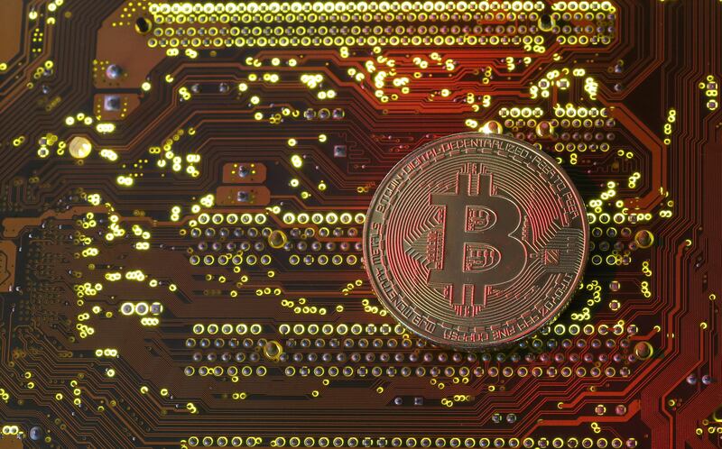 A copy of bitcoin standing on PC motherboard is seen in this illustration picture, October 26, 2017. Picture taken October 26, 2017. REUTERS/Dado Ruvic