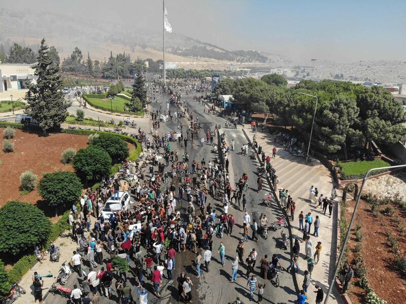 Syrians from the country's northern countryside gather during a demonstration by the Bab al-Hawa crossing between Turkey and Syria's northwestern Idlib province. A FP