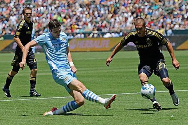 Adam Johnson, centre, in action for Manchester City in a pre-season friendly with Los Angeles Galaxy. Chelsea are reportedly interested in acquiring the England winger.