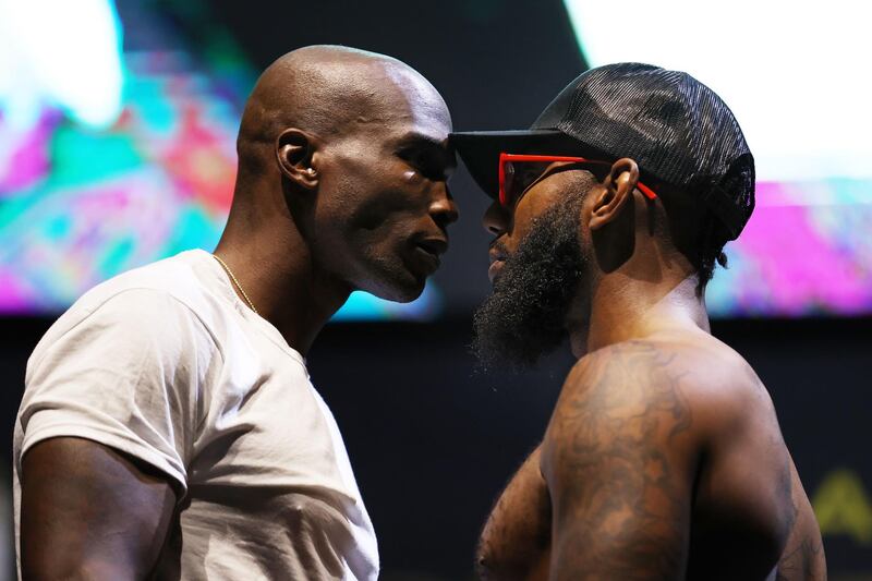 Former NFL player Chad Johnson and Brian Maxwell take part in their weigh-in ahead of their exhibition fight on the same card. AFP