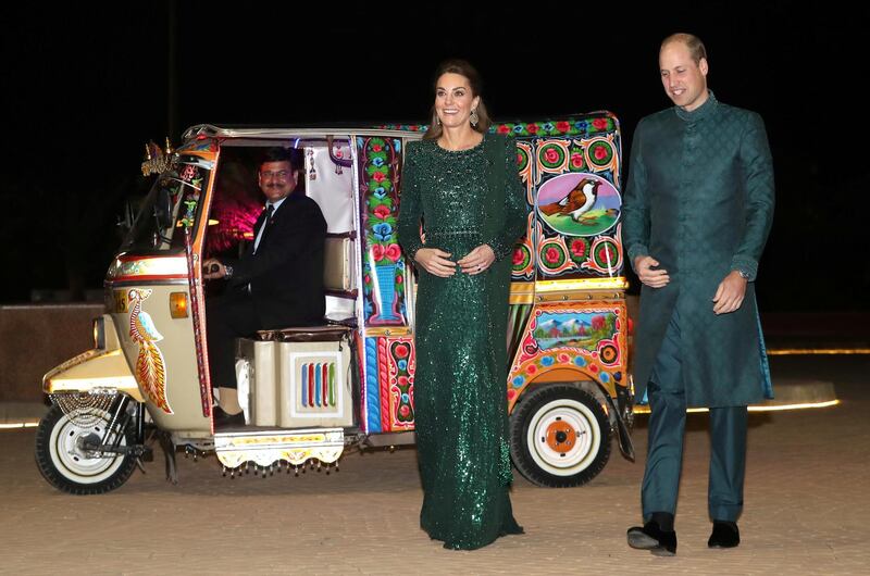 Britain's Prince William and Catherine, Duchess of Cambridge, arrive by Tuk Tuk as they attend a reception hosted by the British High Commissioner to Pakistan, Thomas Drew, at the Pakistan National Monument in Islamabad, Pakistan. REUTERS