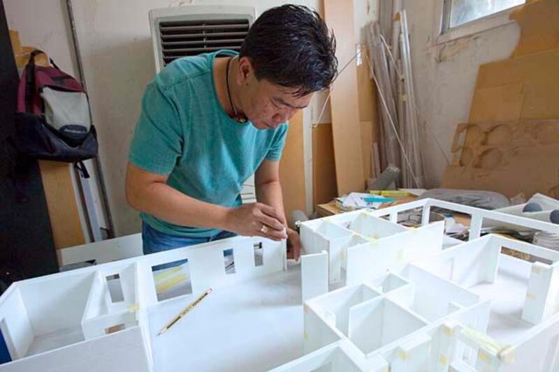 Sharjah, United Arab Emirates, Oct 07, 2012 - A man work on a model at Art Heir Model Making workshop. ( Jaime Puebla / The National Newspaper )