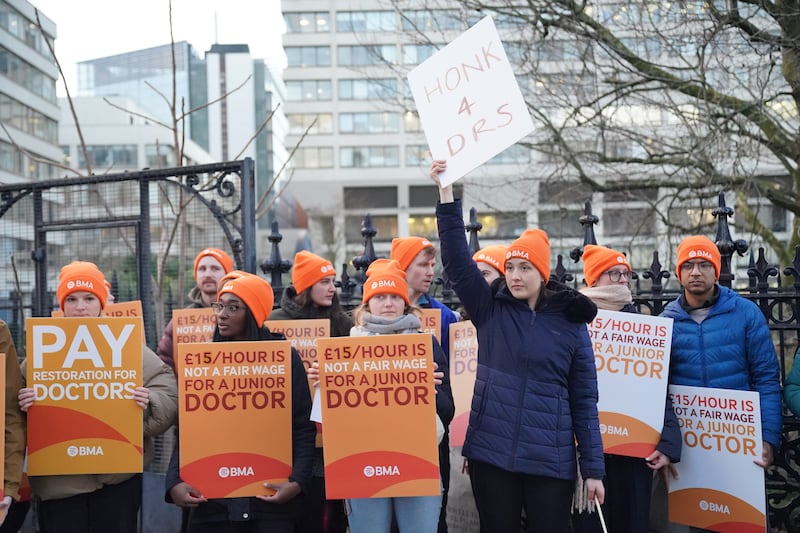 Junior doctors strike outside St Thomas' Hospital in London. PA