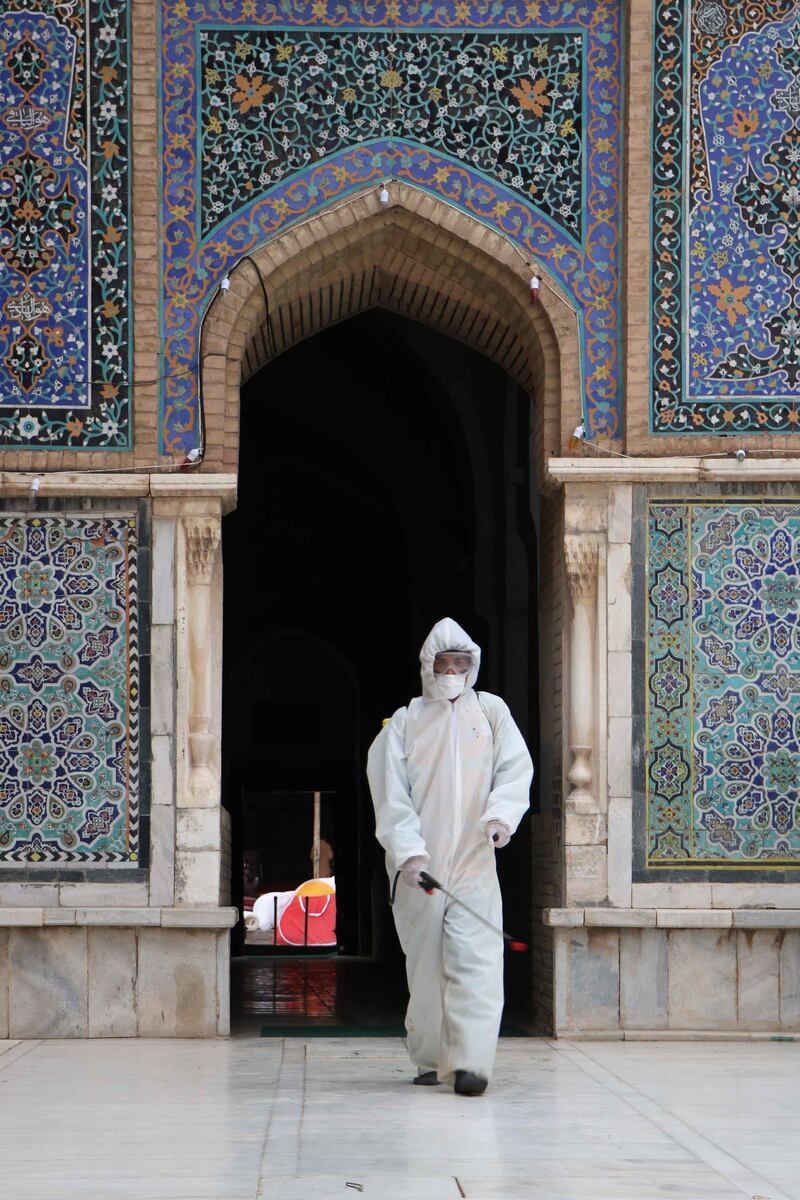 A worker sprays disinfectant inside a mosque during the Muslim holy month of Ramadan in Herat, Afghanistan  EPA