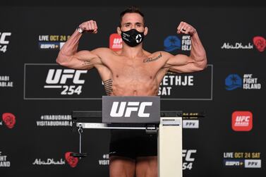 Michael Chandler poses on the scale during the UFC 254 weigh-in in October 2020 on UFC Fight Island, Abu Dhabi. Josh Hedges/Zuffa LLC