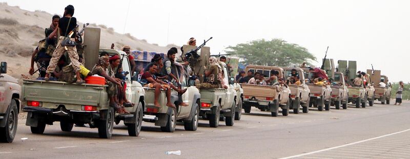 epa06805315 Yemeni forces backed by the Saudi-led coalition take position during an attack on the port city of Hodeidah, on the outskirts of Hodeidah, Yemen, 13 June 2018. According to reports, Yemeni government forces backed by the Saudi-led coalition launched a military offensive to regain control of the Red Sea port-city of Hodeidah acts as an entrance point for Houthi rebel supplies and humanitarian aid.  EPA/NAJEEB ALMAHBOOBI