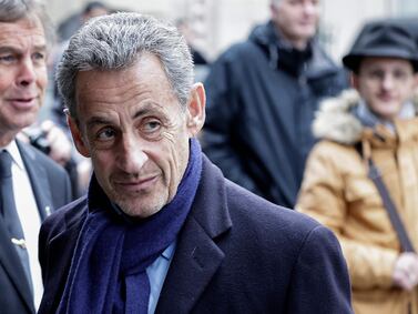 President Nicolas Sarkozy (C) arrives to attend the funeral ceremony of France's former Minister of Culture Frederic Mitterrand in a rare outing for the former French leader.