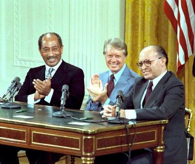 FILE PHOTO: U.S. President Jimmy Carter, Egyptian President Anwar Sadat and Israeli Prime Minister Menachem Begin during the signing of the Camp David Accords in the East Room of the White House in Washington, D.C., September 17, 1978. Courtesy Jimmy Carter Library/National Archives/Handout via REUTERS/File Photo  ATTENTION EDITORS - THIS IMAGE WAS PROVIDED BY A THIRD PARTY