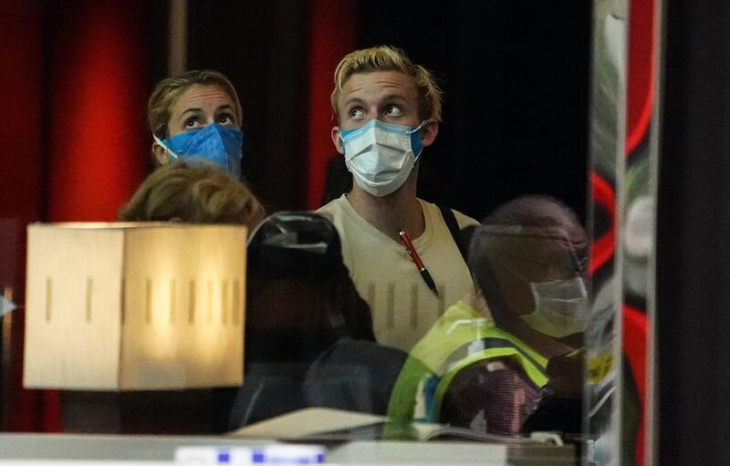 Travellers from overseas wait to check in at the Crown Promenade Hotel for a 14-day quarantine period in Melbourne, Australia. EPA