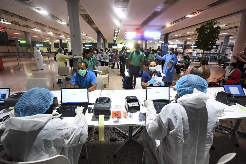 Members of an Indian medical team arrive at Dubai International Airport to help with the coronavirus (COVID-19) pandemic.   AFP