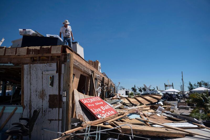 Robert Leisure on what was the second floor of his business premises in the aftermath of Hurricane Ian in Fort Myers, Florida. AFP