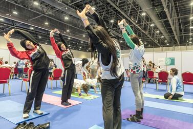 Athletes take part in a yoga session intended to help them focus and relax. The Body Tree area is a yoga and deep breathing section to help with stress and tension. Antonie Robertson / The National