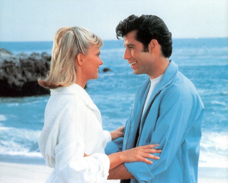 Olivia Newton-John and John Travolta on the beach in a scene from the film 'Grease', 1978. (Photo by Paramount/Getty Images)