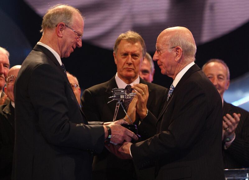 Sir Bobby Charlton receives the Lifetime Achievement Award from brother Jack. PA