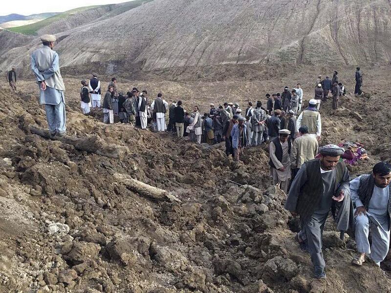 Afghan villagers gather at the site of a landslide at the Argo district in Badakhshan province on May 2, 2014, that killed at least 350 people, according to the UN. Reuters