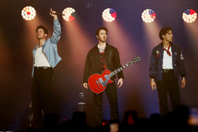 From left: Nick, Joe and Kevin Jonas, members of the band Jonas Brothers, perform at the Movistar Arena in Bogota, Colombia. Almost 14,000 people attended the show.  EPA