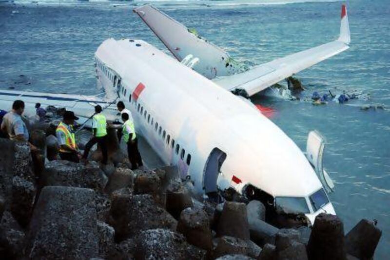 A Lion Air Boeing 737 lies partially submerged in the water three days after it crashed while trying to land at Bali's international airport near Denpasar.