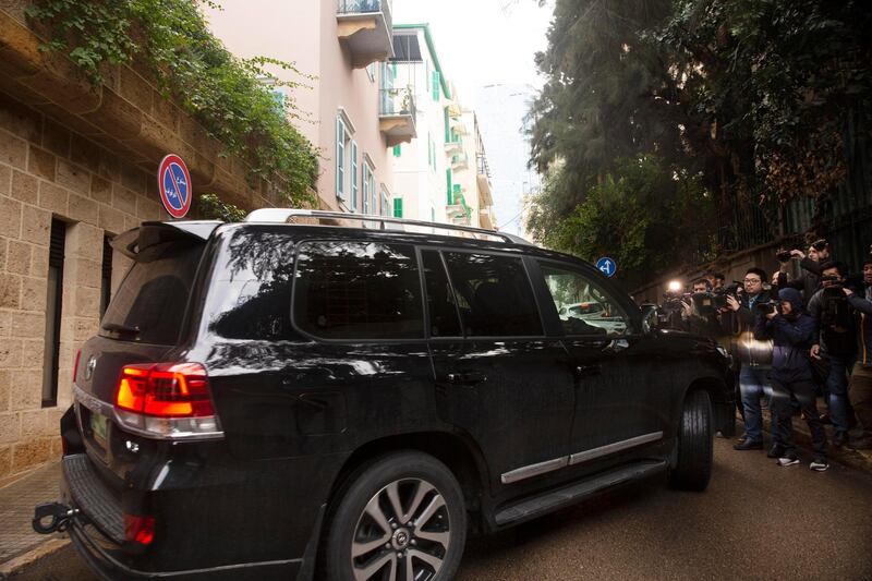 Journalists film a vehicle leaving the home of former Nissan Chairman Carlos Ghosn in Beirut. AP