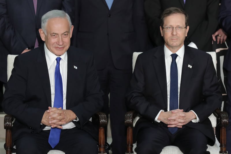 Israeli Prime Minister Benjamin Netanyahu, left, with President Isaac Herzog for the traditional group photo of the new government. EPA