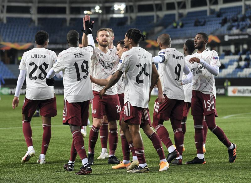 MOLDE, NORWAY - NOVEMBER 26: Reiss Nelson celebrates scoring Arsenal's 2nd goal with Shkodran Mustafi and his team mates during the UEFA Europa League Group B stage match between Molde FK and Arsenal FC at Molde Stadion on November 26, 2020 in Molde, Norway. (Photo by David Price/Arsenal FC via Getty Images)