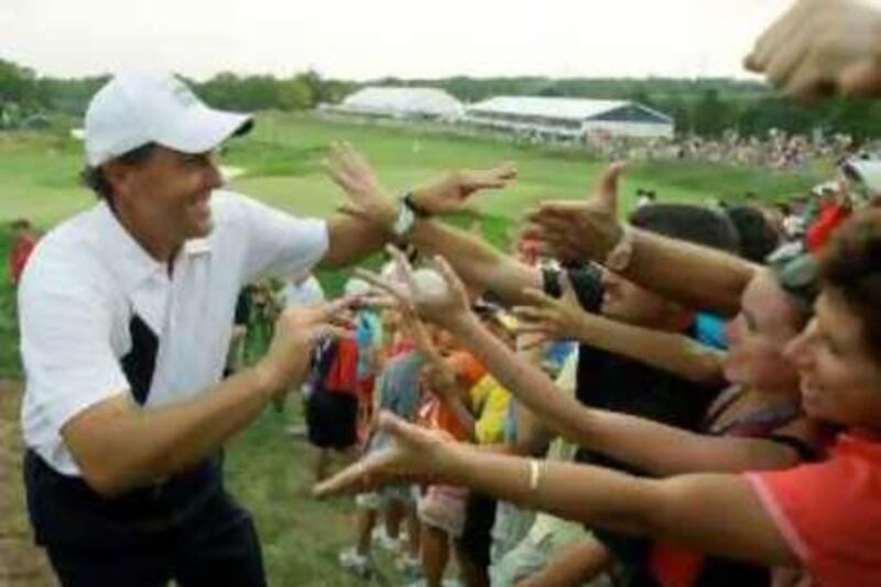 USA's Phil Mickelson is congratulated by the gallery after winning his match against Europe at the Ryder Cup golf tournament at the Valhalla Golf Club, in Louisville, Ky., Friday, Sept. 19, 2008.  (AP Photo/David J. Phillip) *** Local Caption ***  RCG264_Ryder_Cup_Golf.jpg