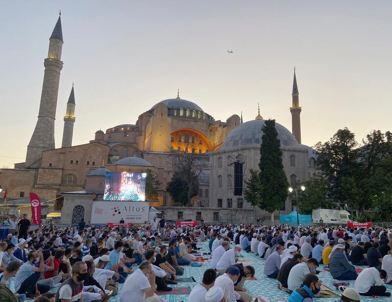 Hundreds of faithful gather early in the morning outside Istanbul's iconic Hagia Sophia for Eid-al Adha prayers, in Istanbul, Friday, July 31, 2020. Small groups of pilgrims performed one of the final rites of the Islamic hajj on Friday as Muslims worldwide marked the start of the Eid al-Adha holiday amid a global pandemic that has impacted nearly every aspect of this year’s pilgrimage and celebrations. The last days of hajj coincide with the four-day Eid al-Adha, or “Feast of Sacrifice,” in which Muslims slaughter livestock and distribute the meat to the poor. (AP Photo/Cavit Ozgul)
