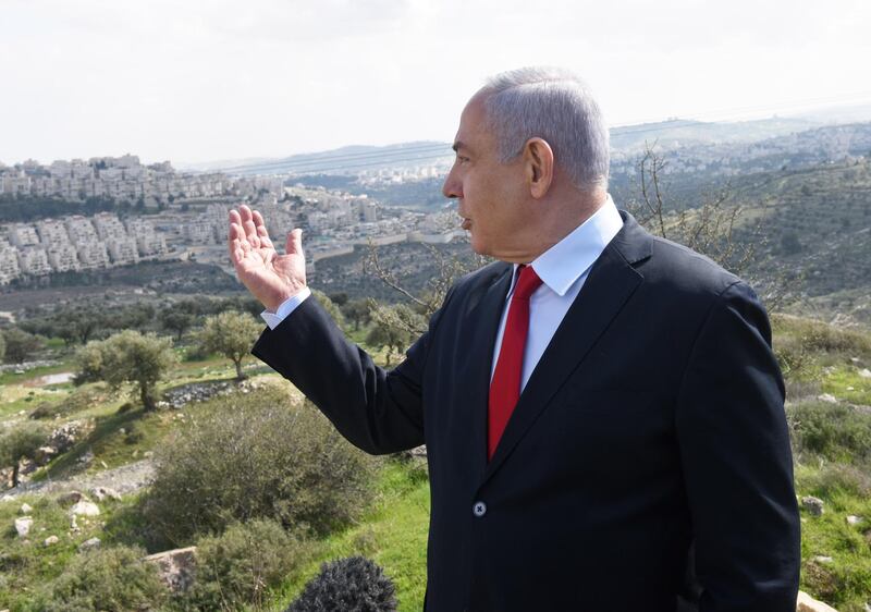 Israeli Prime Minister Benjamin Netanyahu stands at an overview of the Israeli settlement of Har Homa where he plans to build thousands of new homes despite most of the world seeing the constructions illegal. AFP