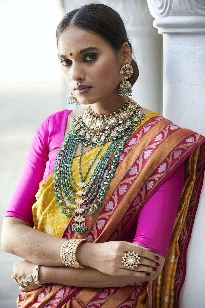 A statement cocktail ring and other jewels from Kishandas & Co, and a traditonally draped sari by Gaurang Shah. Courtesy Numaish