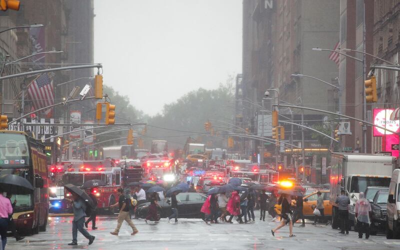 Emergency vehicles fill the street at the scene after a helicopter crashed atop a building in Times Square, New York City. Reuters