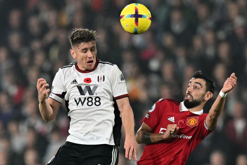 Fulham's Tom Cairney beats Bruno Fernandes of United to a header. AFP