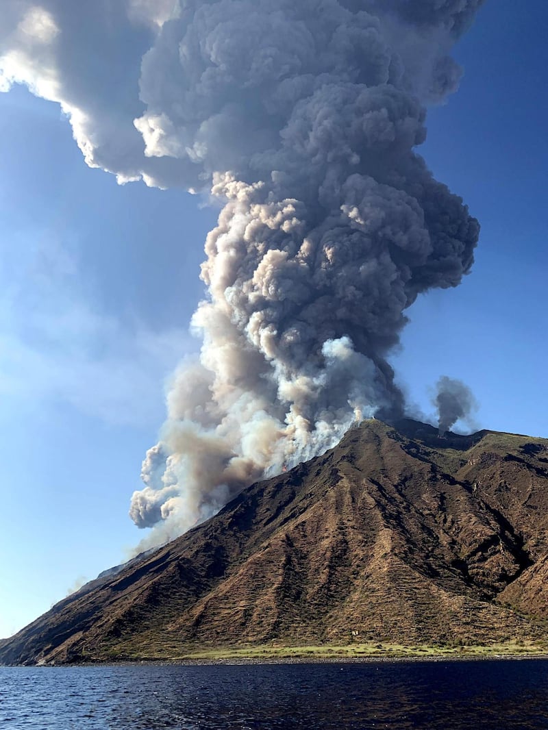 Ash rises into the sky after a volcano eruption on a small island of Stromboli, Italy. According to reports, the island of Stromboli was hit by a set of violent volcano eruptions spurring beach tourists to take into the sea. Two new lava spouts are creeping down the volcano.  EPA